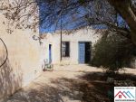 Maison style arbi et terrain