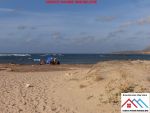 Lot de terrain a la mer de 700 avec titre bleu