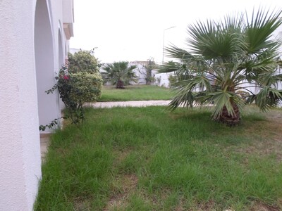 Location vaste villa style américain avec jardin gazonée