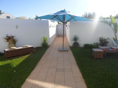 a bungalow has two steps from the sea with swimming pool and beautiful garden