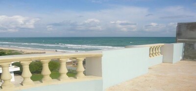a spacious floor with a terrace overlooking the sea