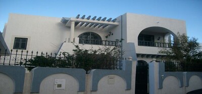 a beautiful villa style American foot in water