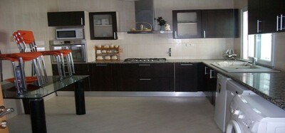 a richly furnished house side sea