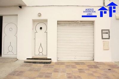 duplex avec garage en face le marché