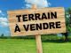 un lot de terrain clôturé dans un quartier calme proche de Craxi