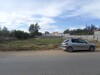 Av un Terrain de 1000 sur la route goudronnée