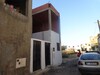 a v une maison avec garage et un étage inachevé